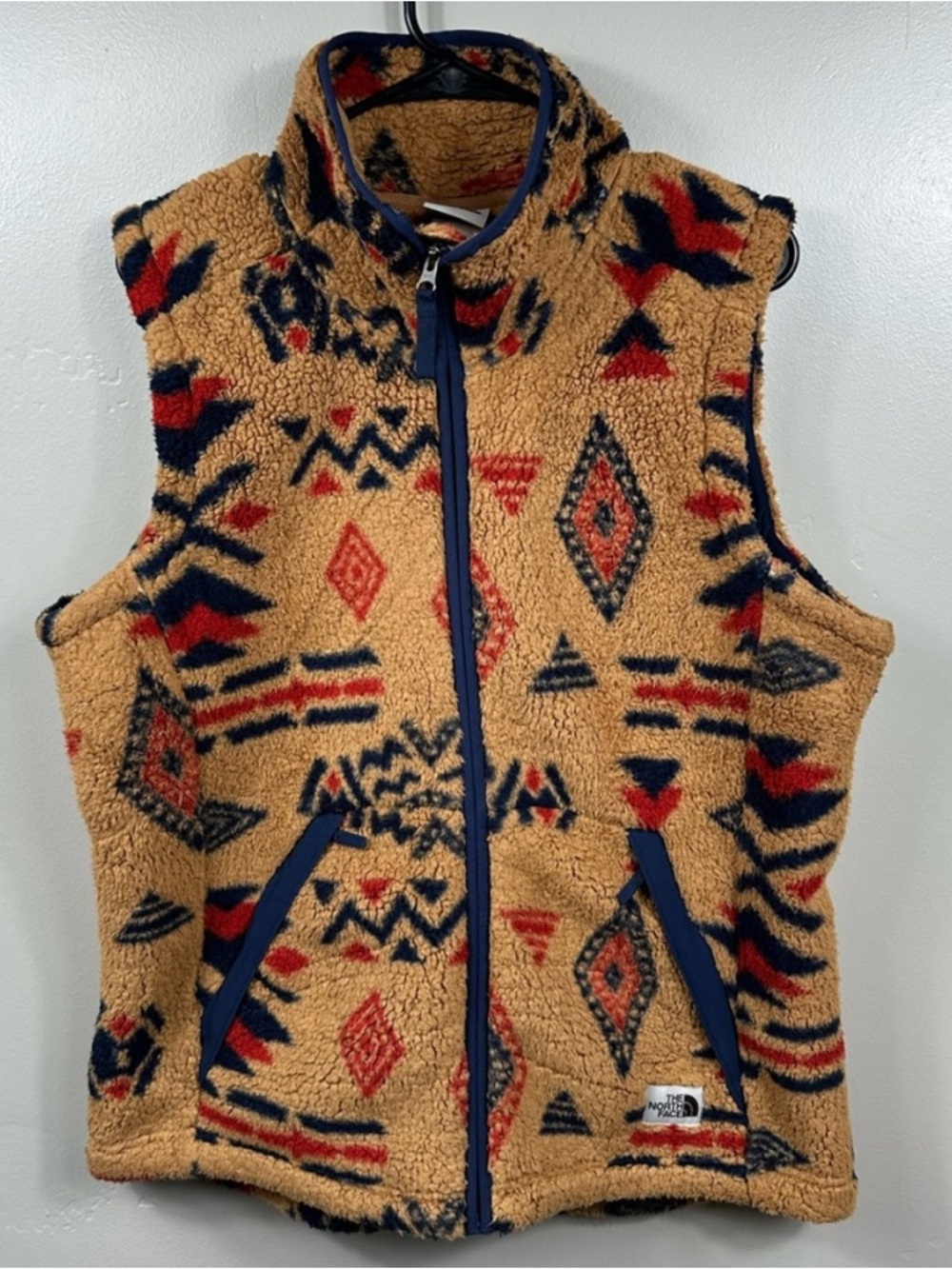 The North Face Tan Sherpa Vest with Navy & Red Aztec Pattern